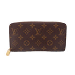 Monogram zip-around wallet with brown patterned canvas and gold zipper hardware