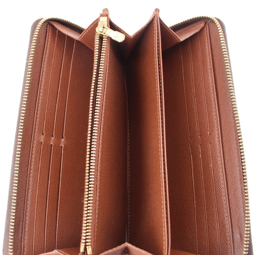 Open zippy wallet interior with brown lining and multiple card slots, zip edges