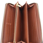 Open zippy wallet interior with brown lining and multiple card slots, zip edges