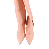 Pair of pink pointed-toe knee-high boots with slender stiletto heels