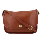 COACH crossbody bag in British tan leather with front flap and turn-lock clasp
