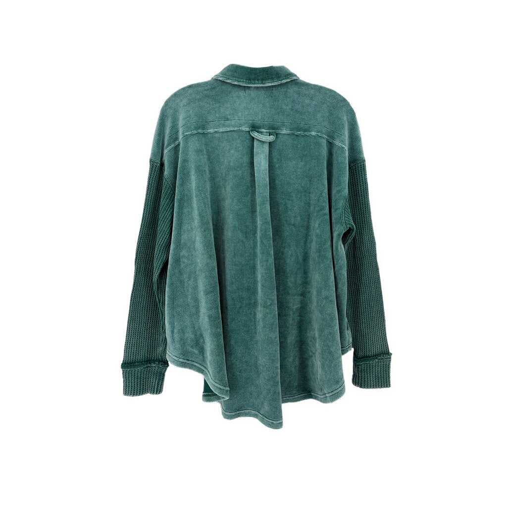 Green corduroy top back view with yoke seam and long sleeves, banded cuffs