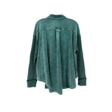 Green corduroy top back view with yoke seam and long sleeves, banded cuffs