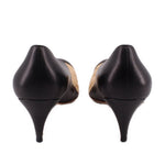 Two-tone kitten heels with black back and low heel, nude lining near the heel
