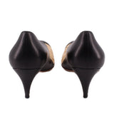 Two-tone kitten heels with black back and low heel, nude lining near the heel