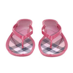 Pink rubber thong sandals, T-strap with gray and white check-pattern footbed