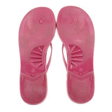 Pink rubber thong sandals with textured tread soles and oval logo detail