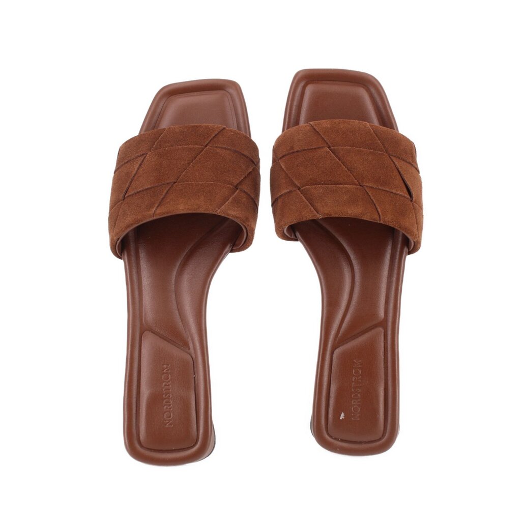 Brown suede slide sandals open-toe design with padded footbed and stitched upper
