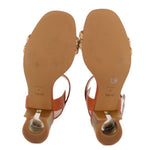 COACH leather heeled sandals, bottom view showing outsole and block heel