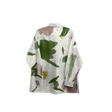 White back button-up shirt with green and yellow abstract print, long sleeves