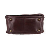 Oxblood leather COACH shoulder bag bottom edge with four gold-tone eyelets