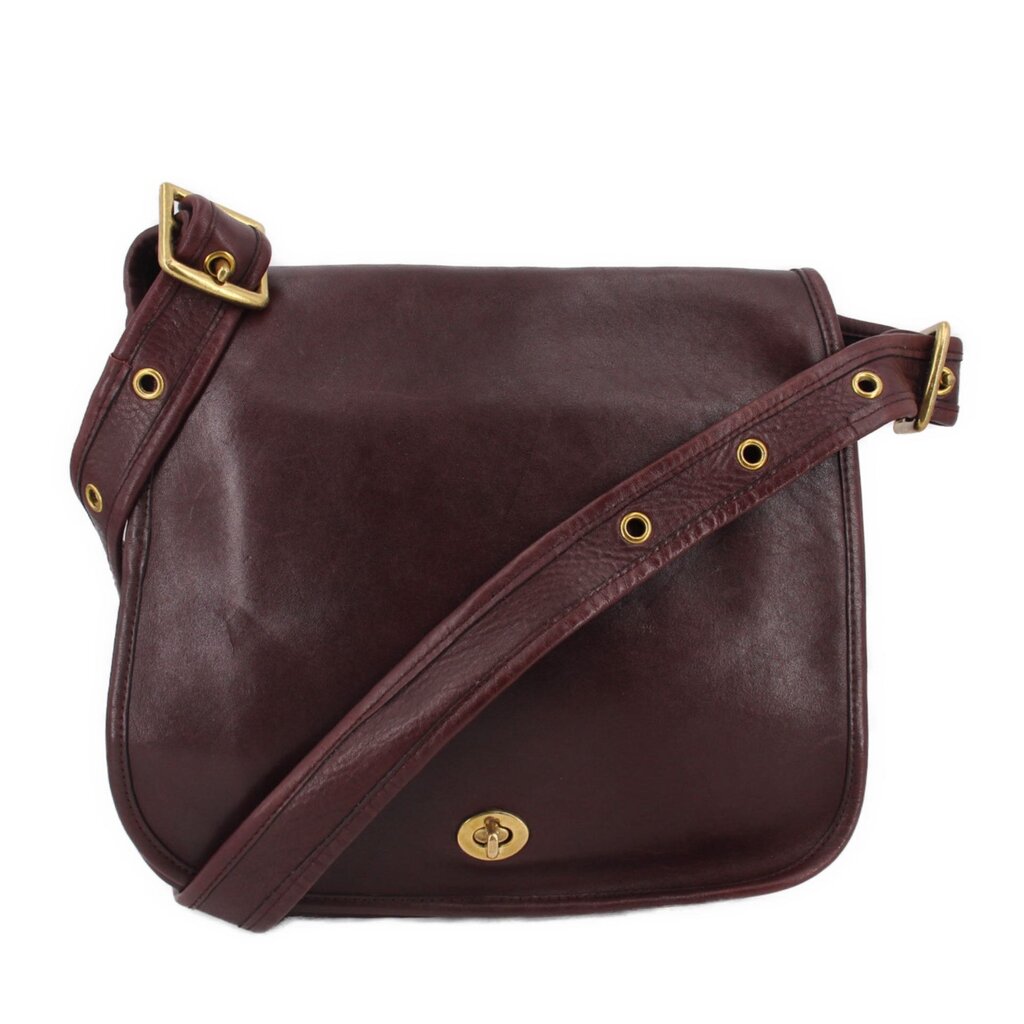 Oxblood leather COACH shoulder bag with flap and gold-tone turn-lock, crossbody strap