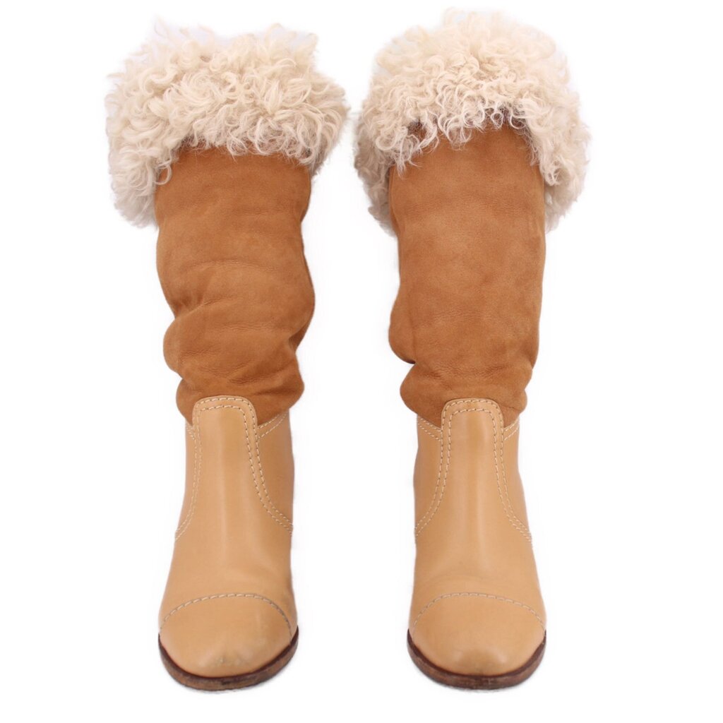 Brown suede boots with tall shearling cuffs and contrasting beige panels