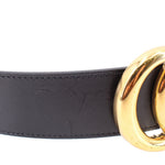 Black leather belt with gold buckle hardware and embossed finish