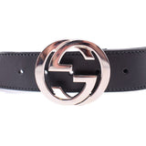 Black belt buckle with silver-tone Interlocking G logo close-up