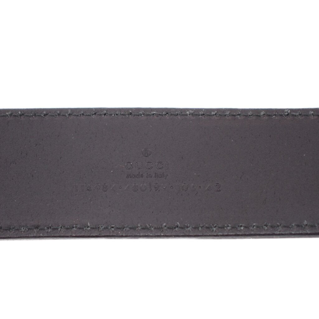 Black leather belt strap with stitched edge and embossed maker stamp
