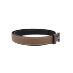 Taupe leather belt with black side buckle and stitched trim, rectangular keeper.