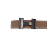 Taupe belt with double-tone H-style buckle, visible stitching and strap loops.