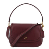 Merlot leather crossbody bag with curved flap and turn-lock closure, gold-tone hardware.