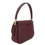 Merlot leather crossbody bag side profile with zipper pull charm and gold-tone hardware.