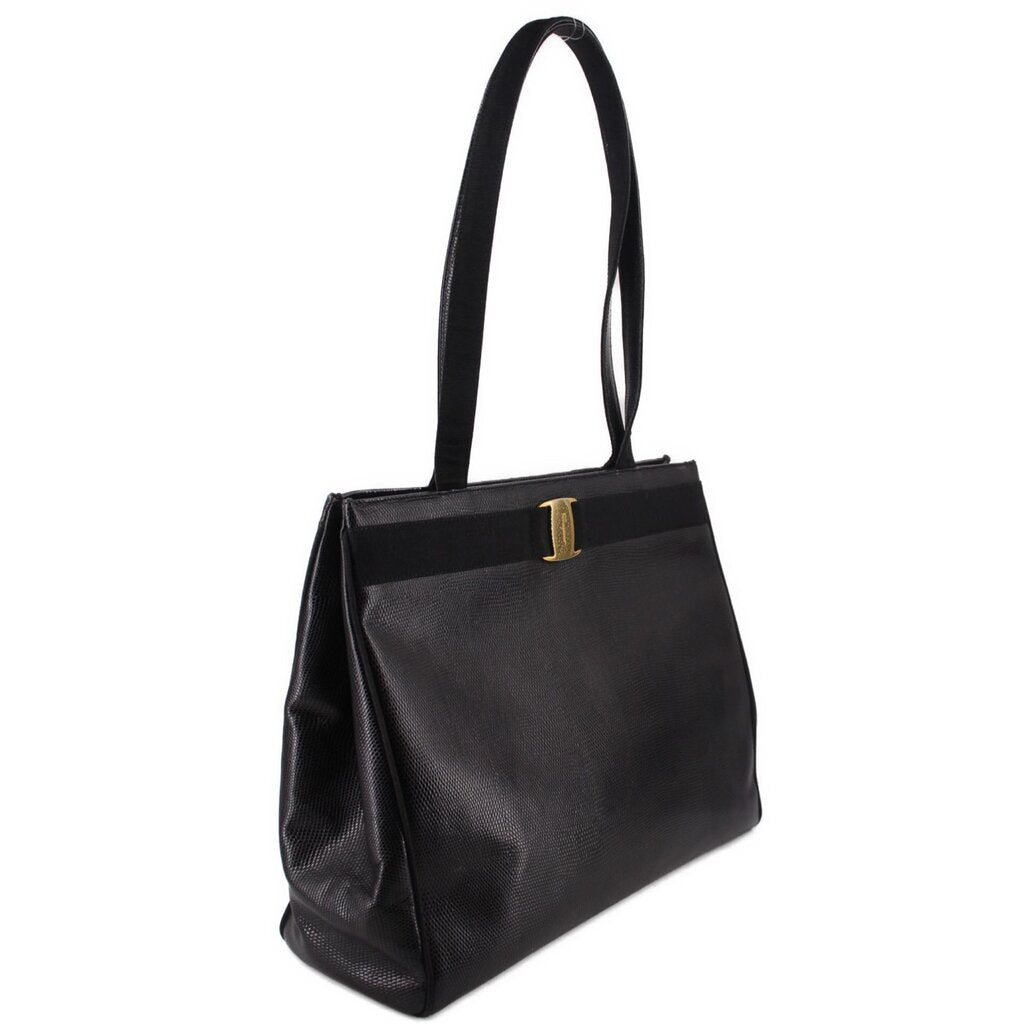 Black leather vintage shoulder bag with structured sides and top handle