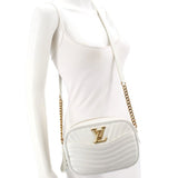 White quilted crossbody camera bag with gold-tone LV logo and chain strap
