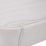 Close-up of white bag panel with stitched trim and curved seam detail