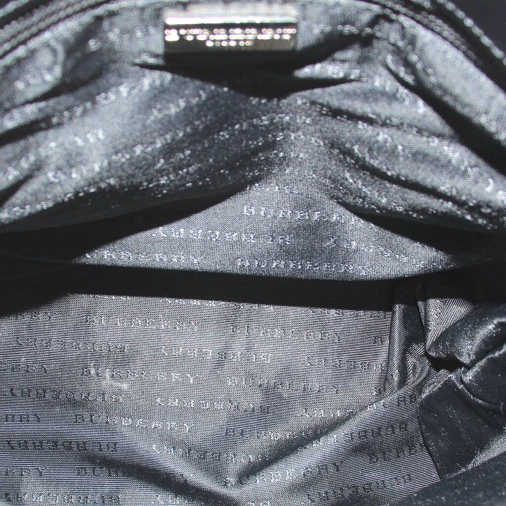 BURBERRY tote bag interior lining with black fabric and repeating logo pattern