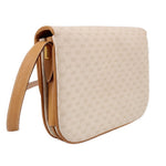 GUCCI vintage crossbody bag side profile with tan strap and curved flap edge