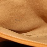 GUCCI crossbody bag interior lining close-up in tan leather texture