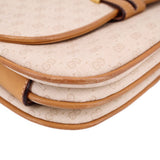 GUCCI crossbody bag corner close-up with tan leather trim and stitched edge