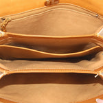 GUCCI crossbody bag interior view with tan lining and top zip opening