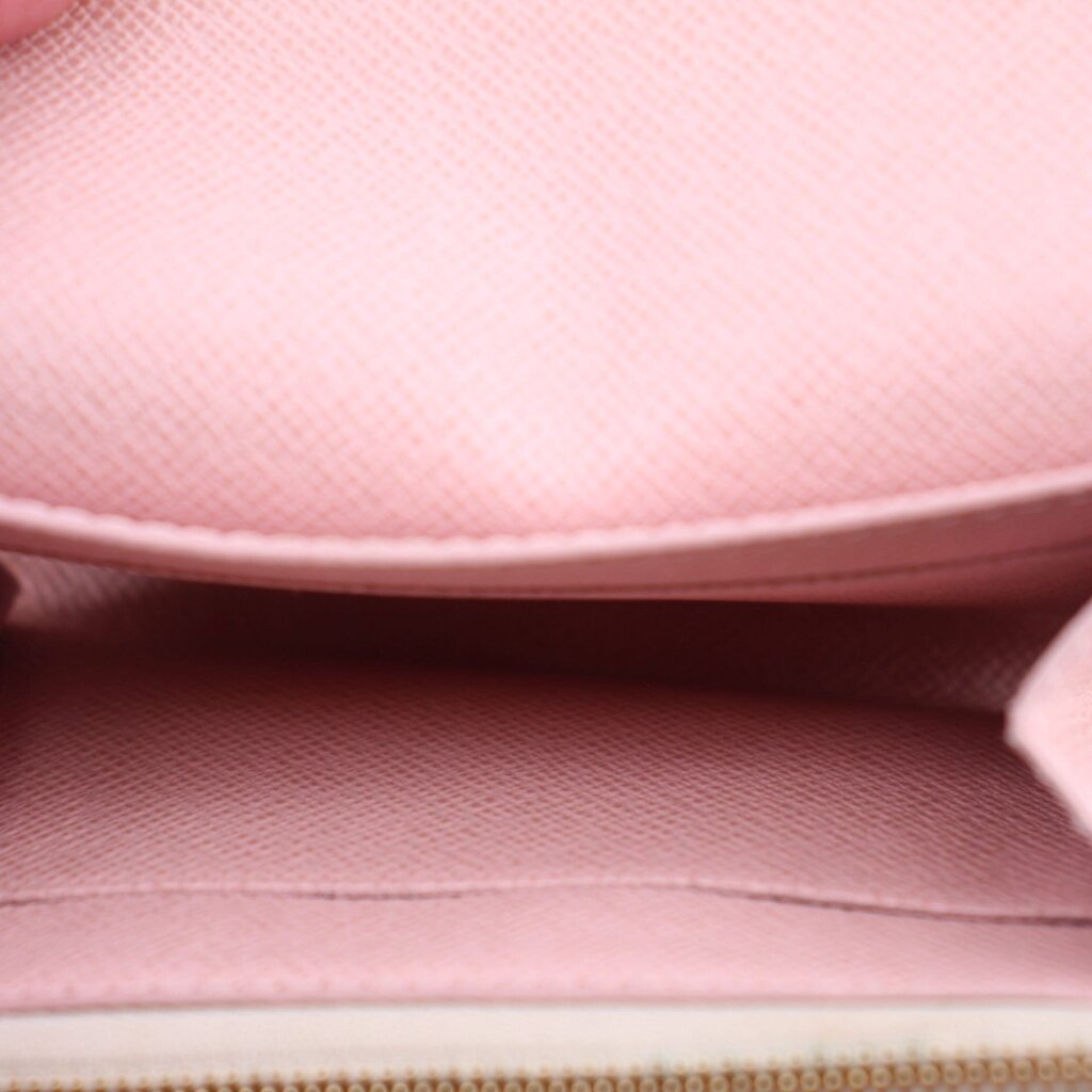 Coin purse wallet interior lining in pink fabric with folded flap edge