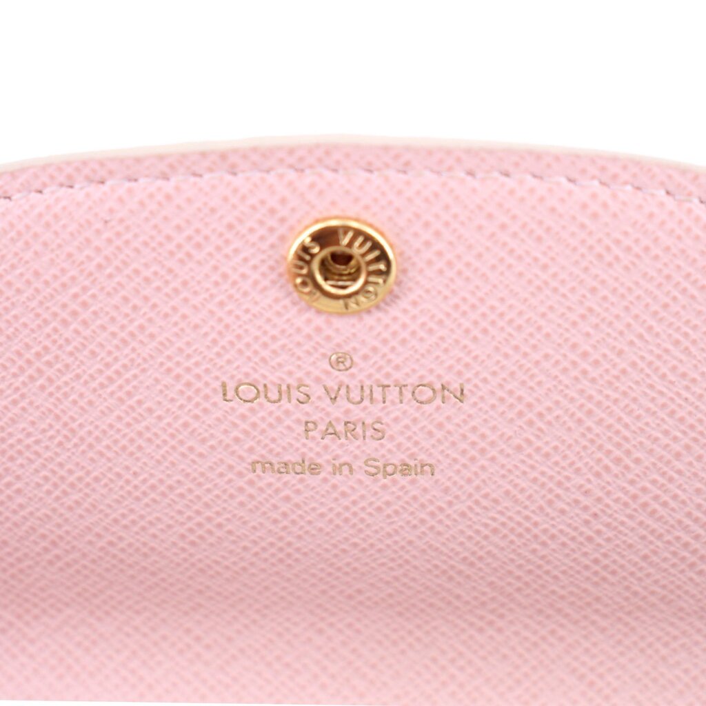 Pink interior coin purse lining with gold button and LOUIS VUITTON PARIS stamp