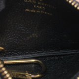 Close-up of black Empreinte leather and gold zipper hardware, made in France