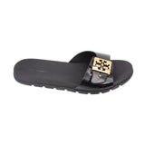 Black slide sandals, open-toe with gold-tone logo buckle across strap