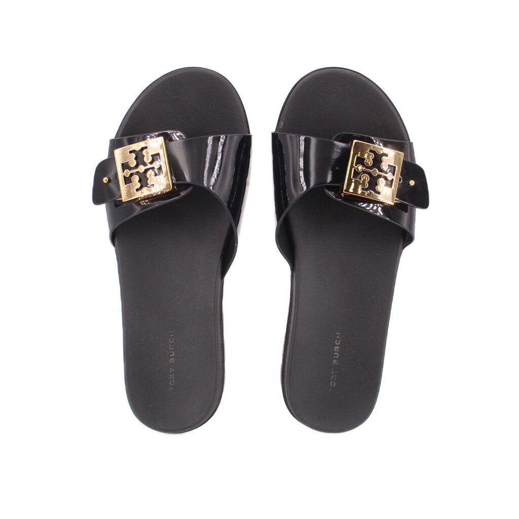 Black slide sandals with glossy black straps and gold logo square buckle