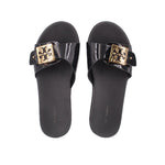 Black slide sandals with glossy black straps and gold logo square buckle