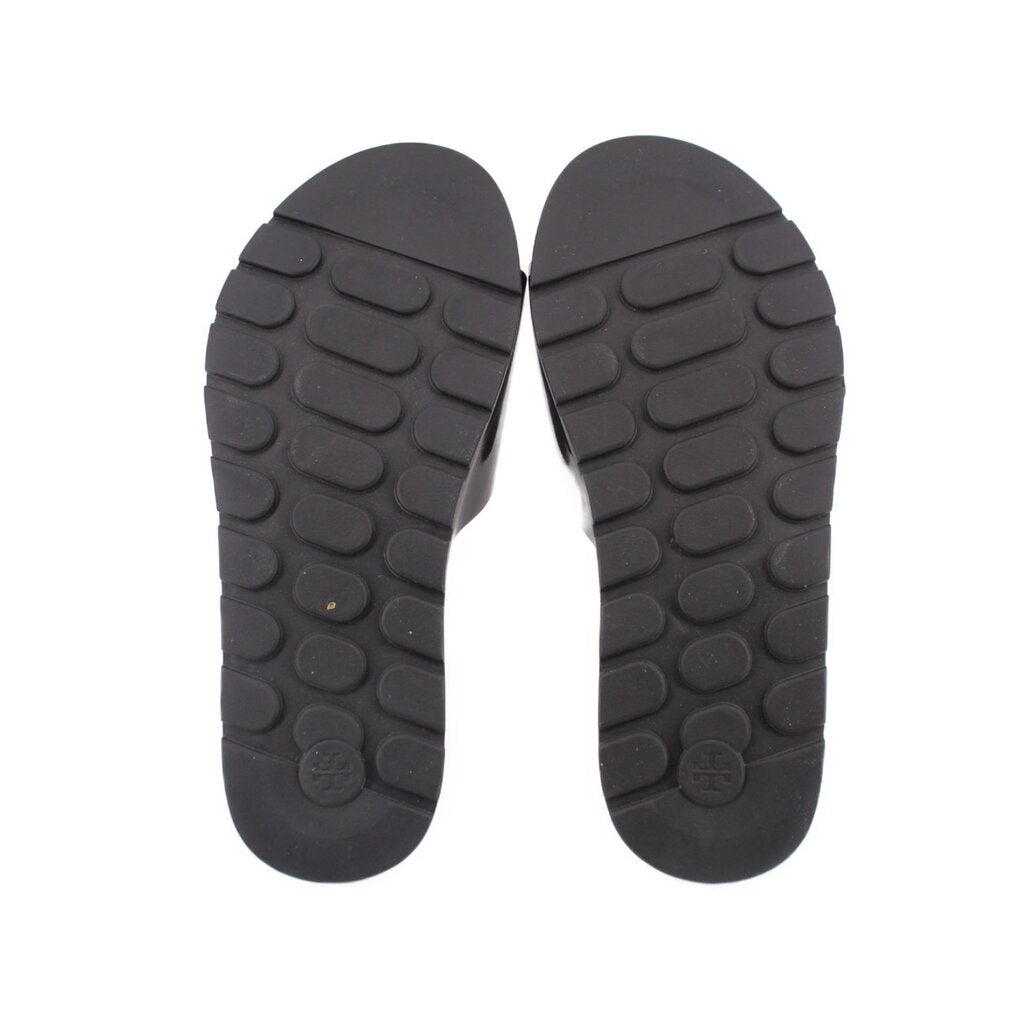 Black rubber outsole for slide sandals with textured tread pattern