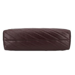 Brown quilted leather shoulder bag with horizontal stitching and gold chain strap