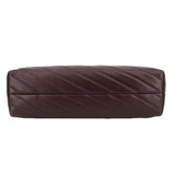 Brown quilted leather shoulder bag with horizontal stitching and gold chain strap