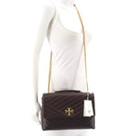 Brown quilted leather mini crossbody bag with gold chain strap and T logo clasp