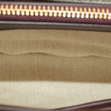 Beige woven interior lining with gold zipper trim at top edge