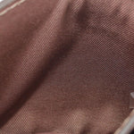 Brown leather texture close-up with fine grain and stitching