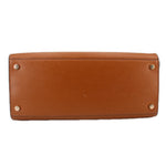 Brown leather satchel bottom panel with four metal feet