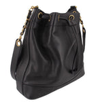 CHANEL black bucket crossbody bag with drawstring top, grommets, and shoulder strap