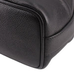 CHANEL black leather bucket crossbody bag close-up of rounded side edge and texture