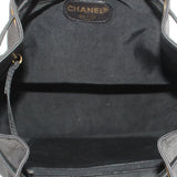 CHANEL black bucket crossbody bag interior with CHANEL label and drawstring opening