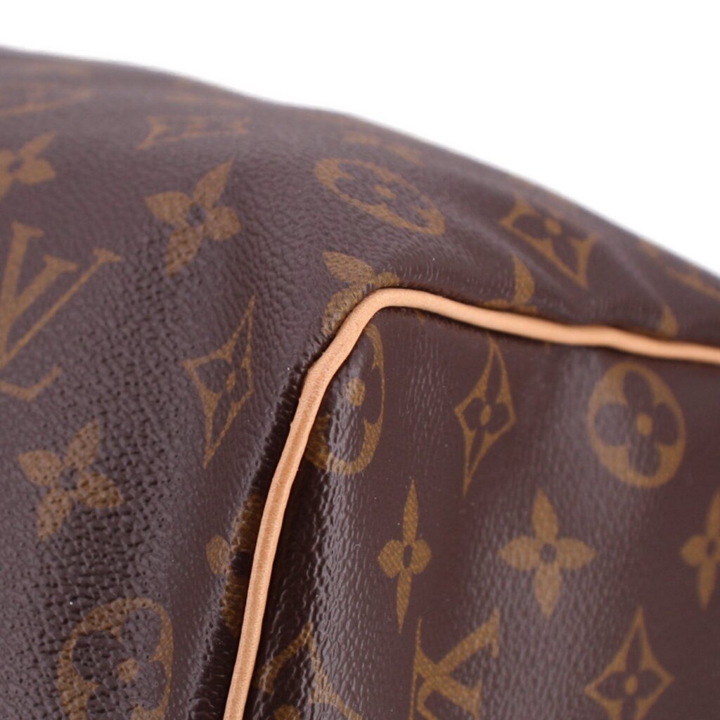 Monogram canvas bag corner with tan leather piping