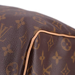 Monogram canvas bag corner with tan leather piping
